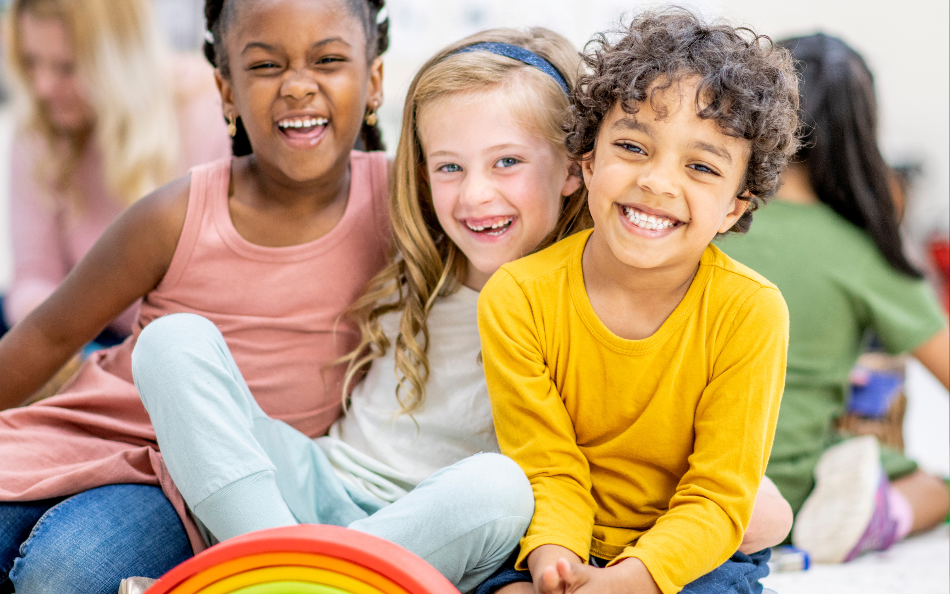 photo show three diverse, happy kids